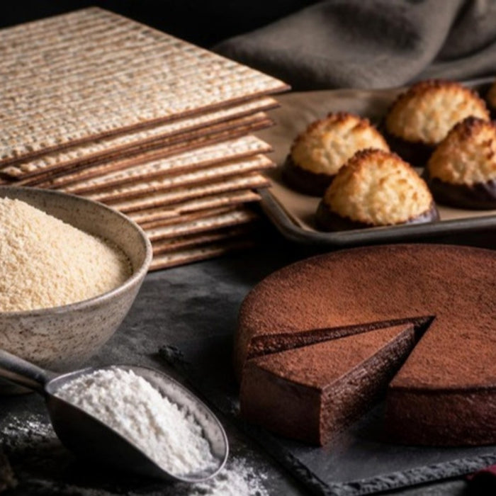 Passover baking table with matzo, almond flour, macaroons and flourless torte