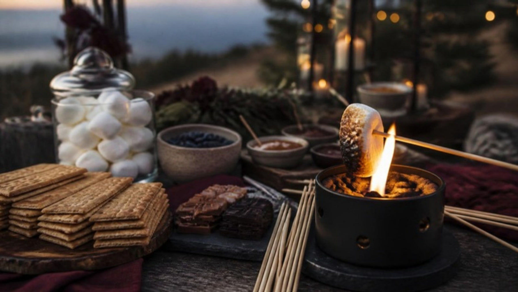 Outdoor s'mores station with marshmallows, graham crackers and chocolate
