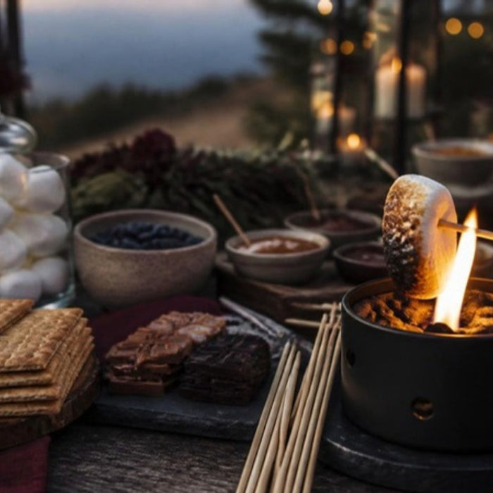Outdoor s'mores station with marshmallows, graham crackers and chocolate