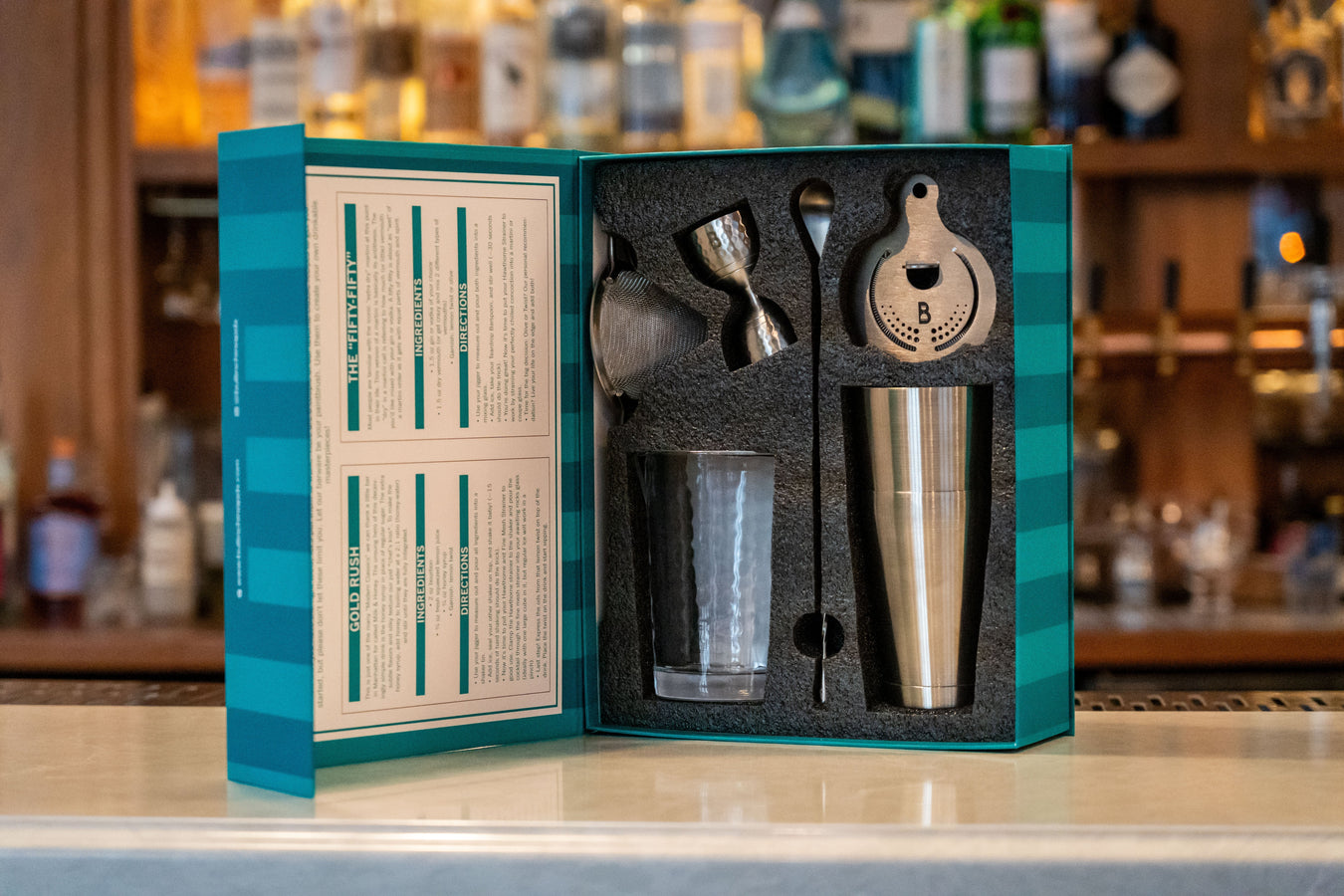 Bull In China professional bar tools including shaker tins, mixing glasses, and jiggers