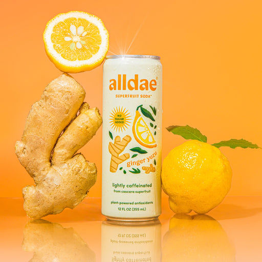 12-pack of AllDae Ginger Yuzu Superfruit Soda, a Whole30 Approved sparkling drink made with upcycled coffee fruit, tropical juice, and no added sugar.