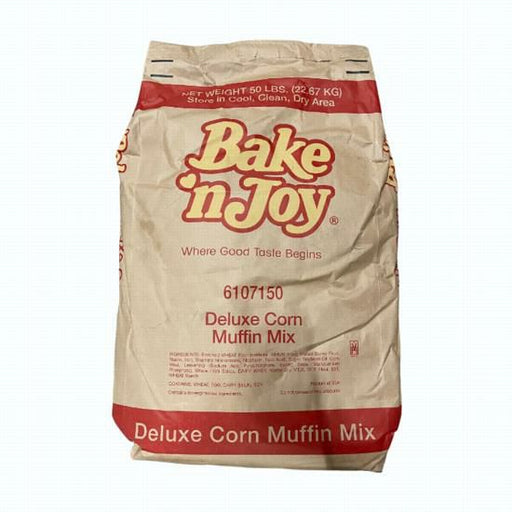 Bulk 50 lb bag of BAKE & JOY Deluxe Corn Muffin Mix, prominently displaying the product branding and quantity.