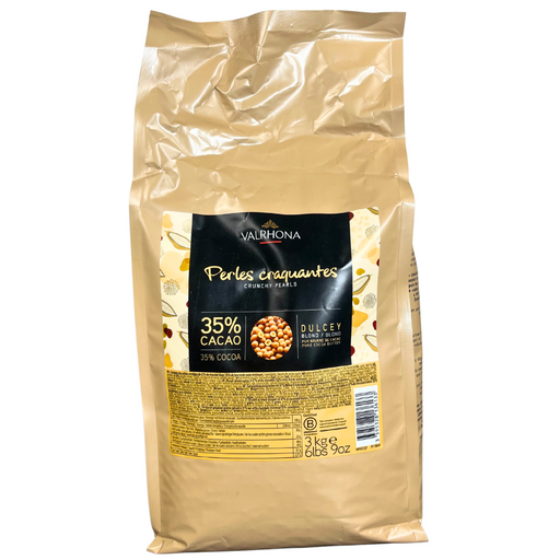 Bag of Valrhona Dulcey Crunchy Pearls – blond chocolate pearls with 35% cocoa in a 3kg professional format.