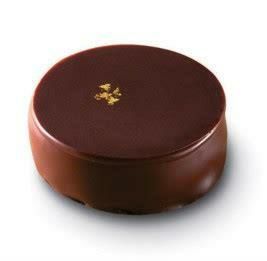 Box of VALRHONA Gianduja Bonbons, luxurious hazelnut chocolate confections for a refined tasting experience.