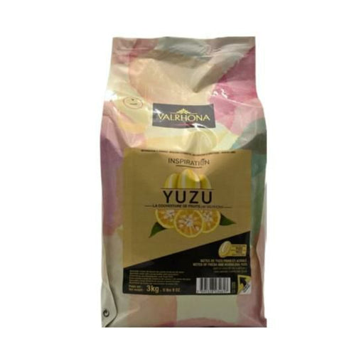 Bag of VALRHONA Yuzu Inspiration Feves, exotic citrus chocolate for adding a unique, tangy twist to desserts and confections.