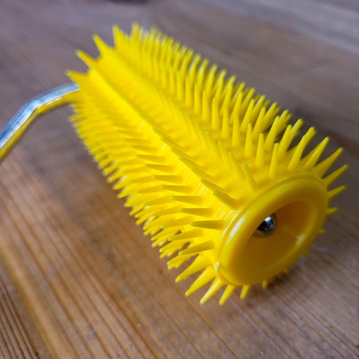 Uncapping Punch Roller