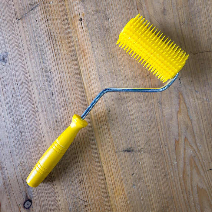 Uncapping Punch Roller